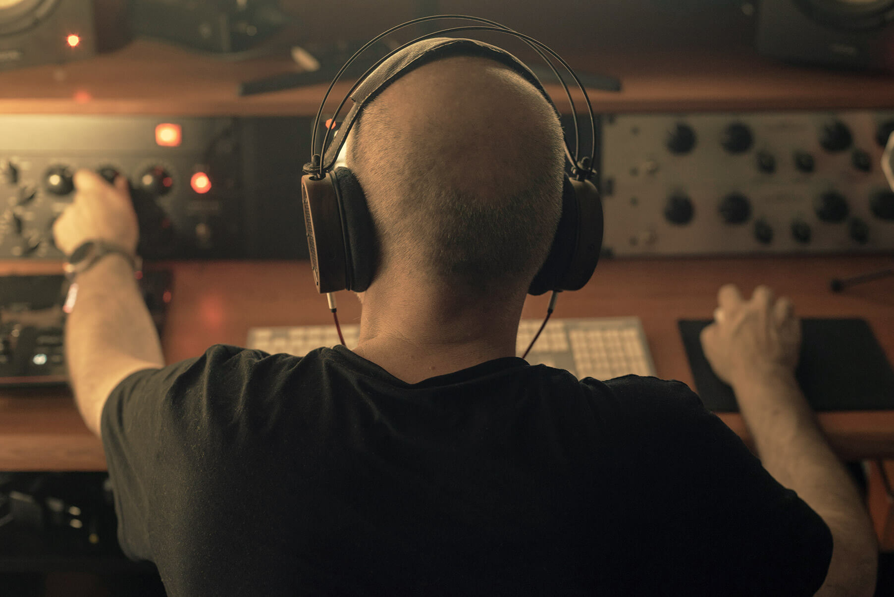 Mastering engineer working with analog audio equipment